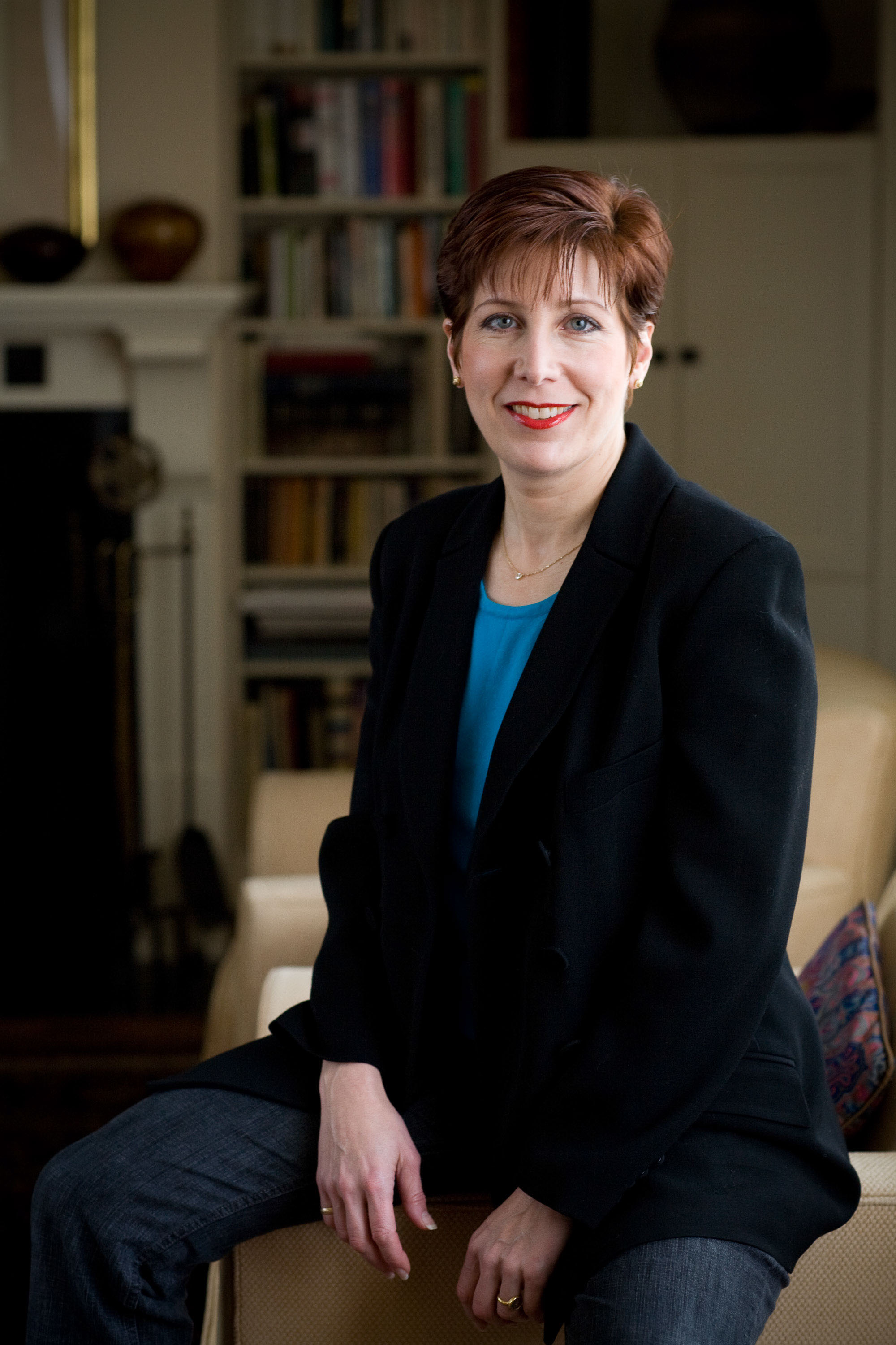 An evironmental portrait of a business woman in her home office.