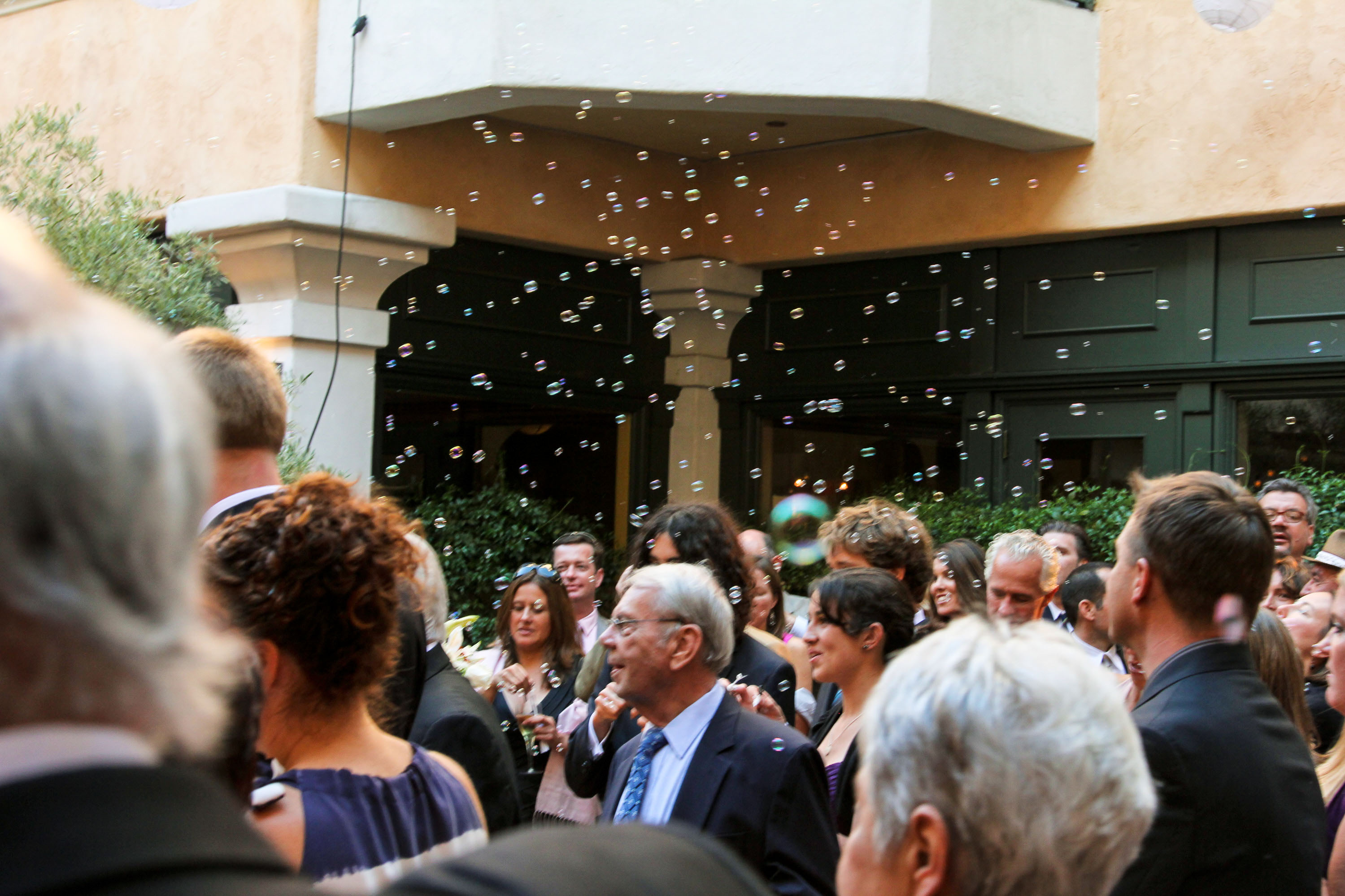 Bubbles float above the guests  at the Garden Court Hotel in Palo Alto