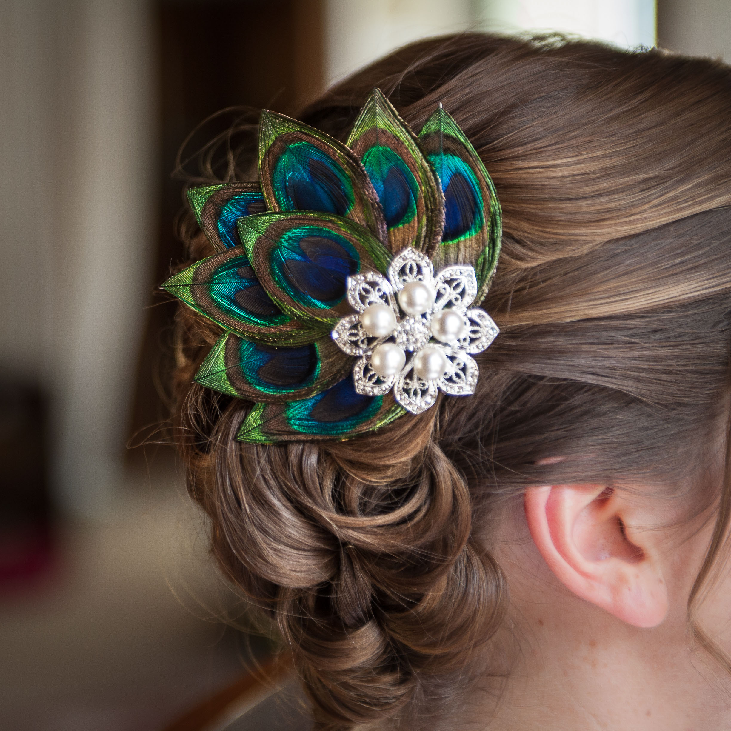 Carlie's beautiful peack feather hairpiece at Pema Osel Ling in the Santa Cruz mountains
