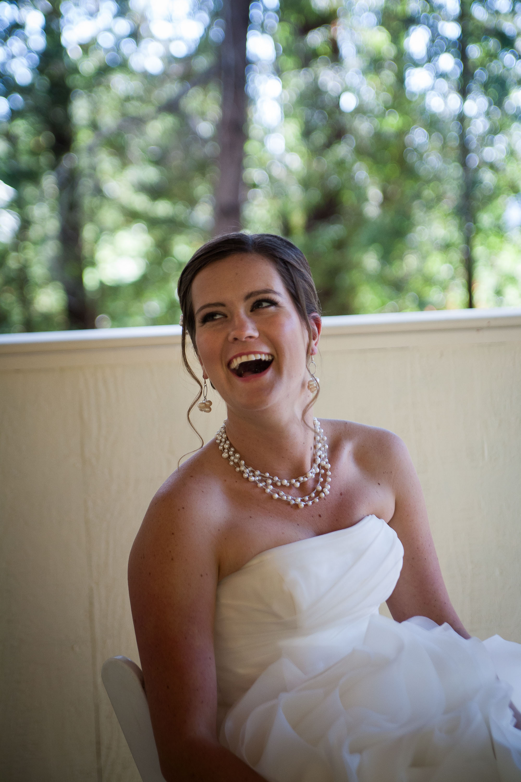 The bride laughs at a joke at Pema Osel Ling in the Santa Cruz mountains