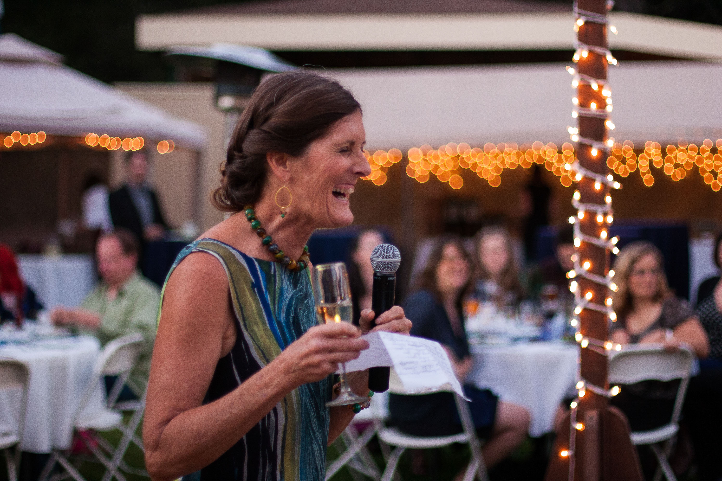 The bride's mom cracks up as she delivers her toast, at Pema Osel Ling in the Santa Cruz mountains