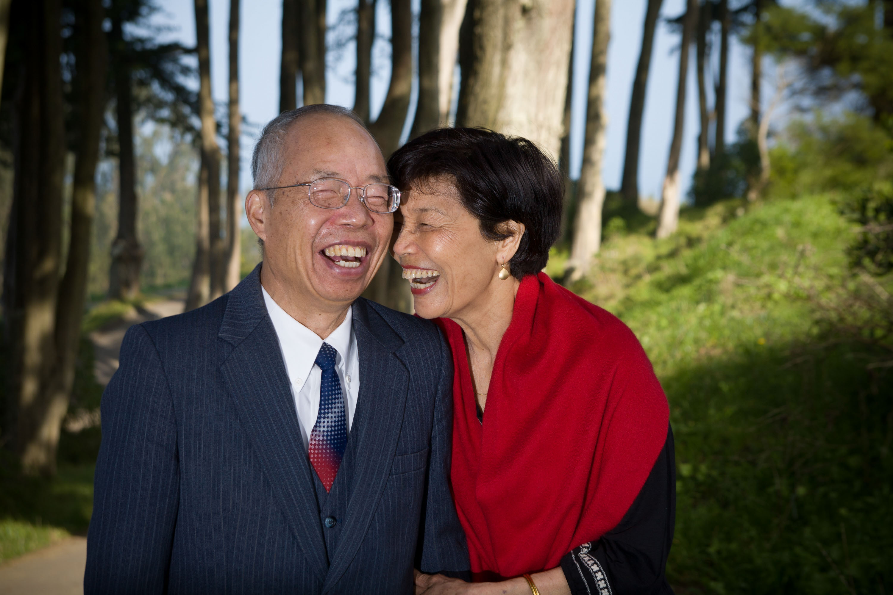 Asian grandparents laugh together at the Legion of Honor.