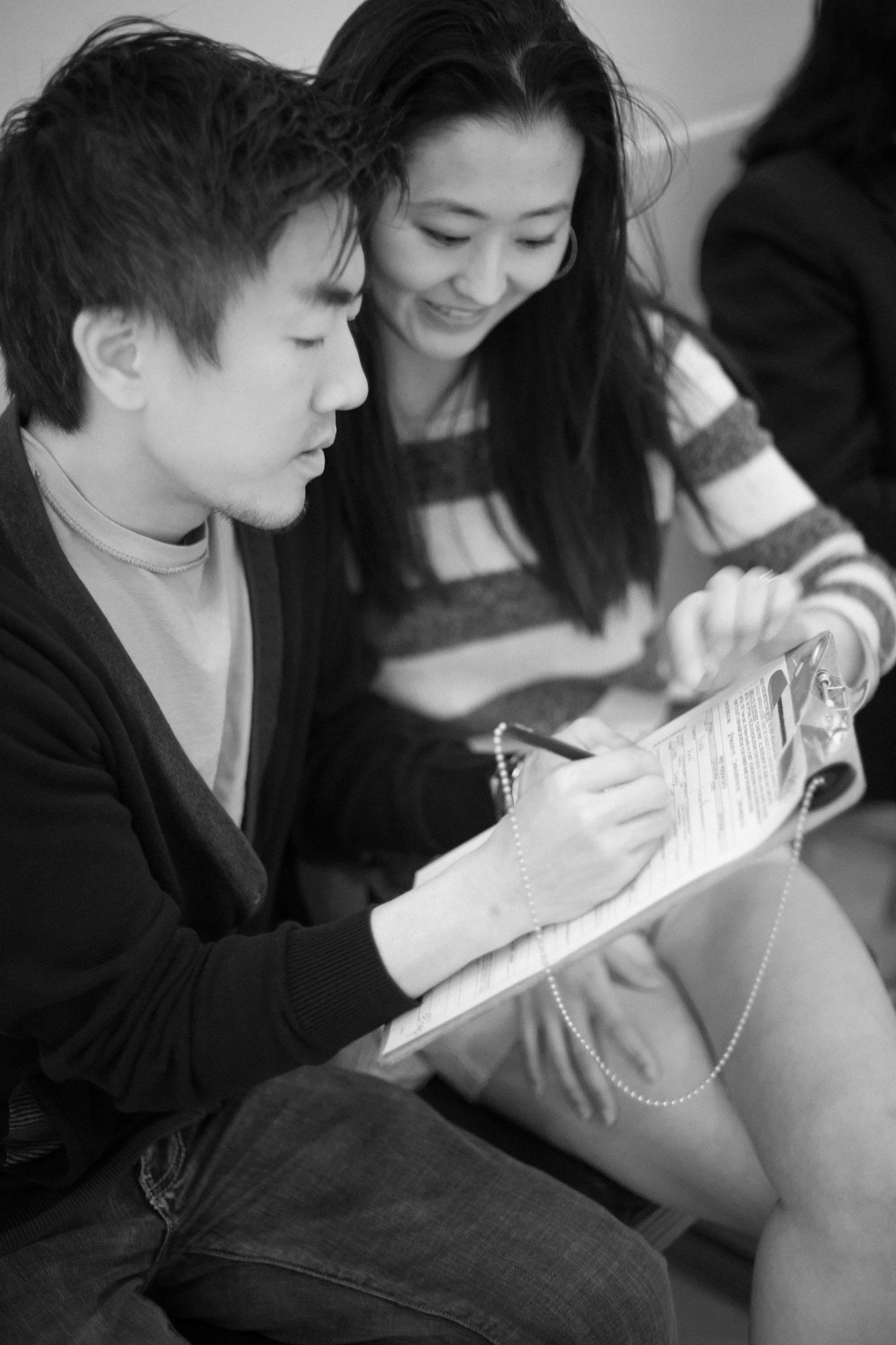 Filling out the paperwork at a San Francisco City Hall wedding, by noted Bay Area photographer Checkerbox