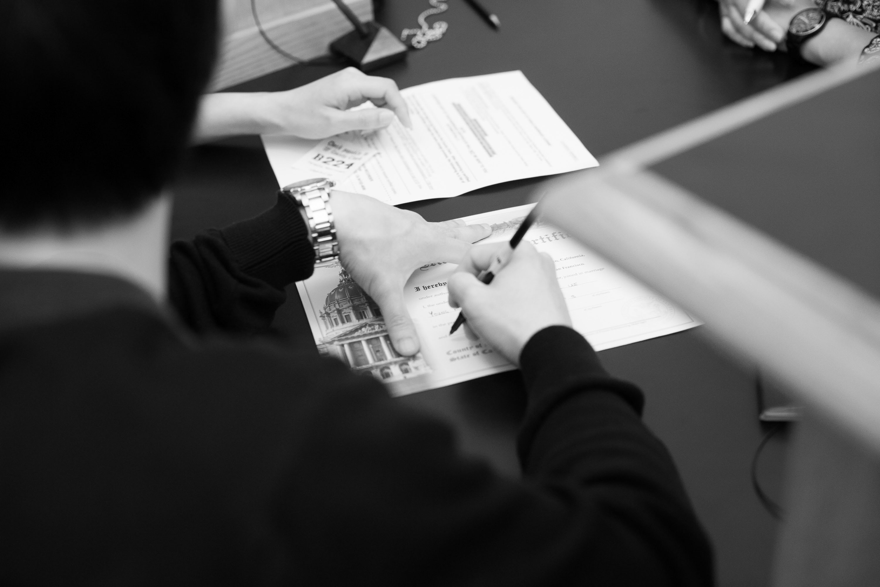 Signing the marriage license at a San Francisco City Hall wedding