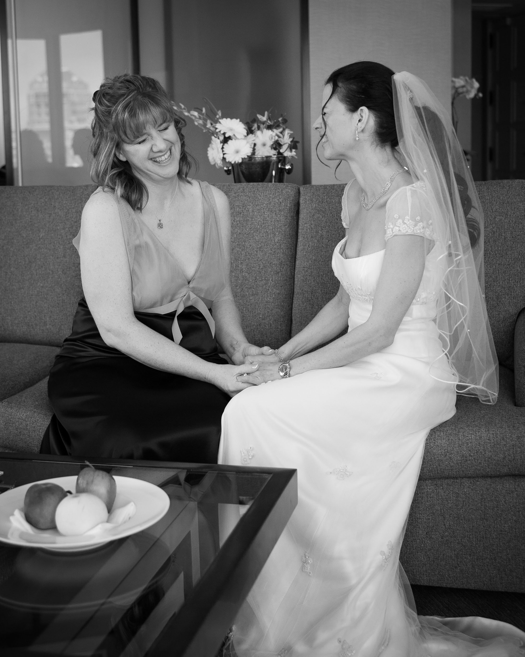 The bride takes a moment with her mom in the bridal suite at the St. Francis Hotel in San Francisco