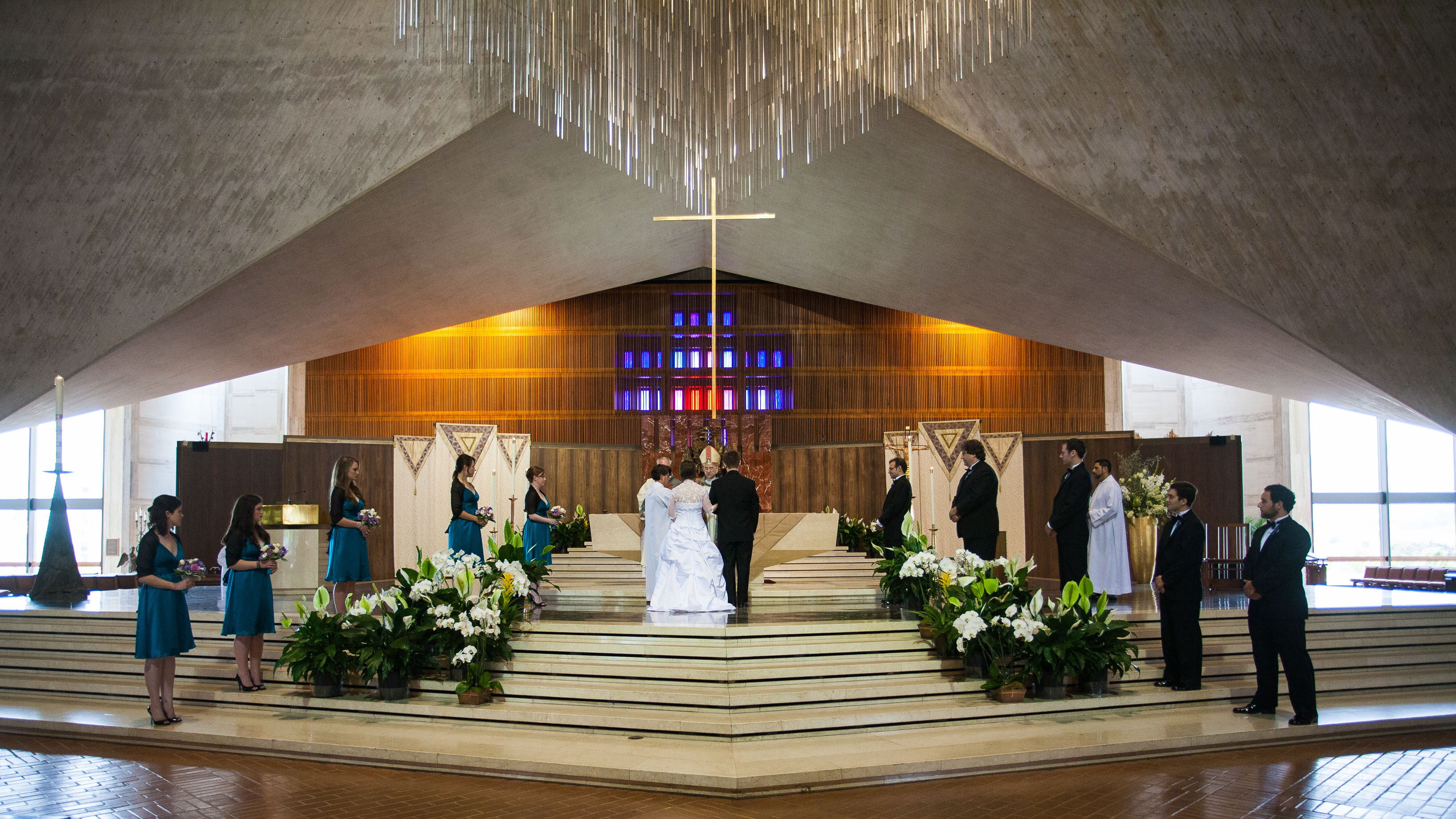 A couple takes their wedding vows  at St. Mary's Cathedral in San Francisco.