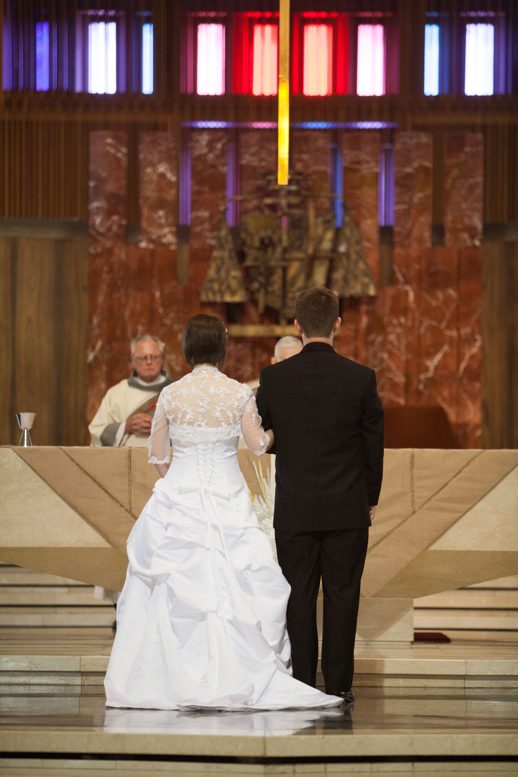 John and Corey beneath the stunning stained glass  at St. Mary's Cathedral in San Francisco.