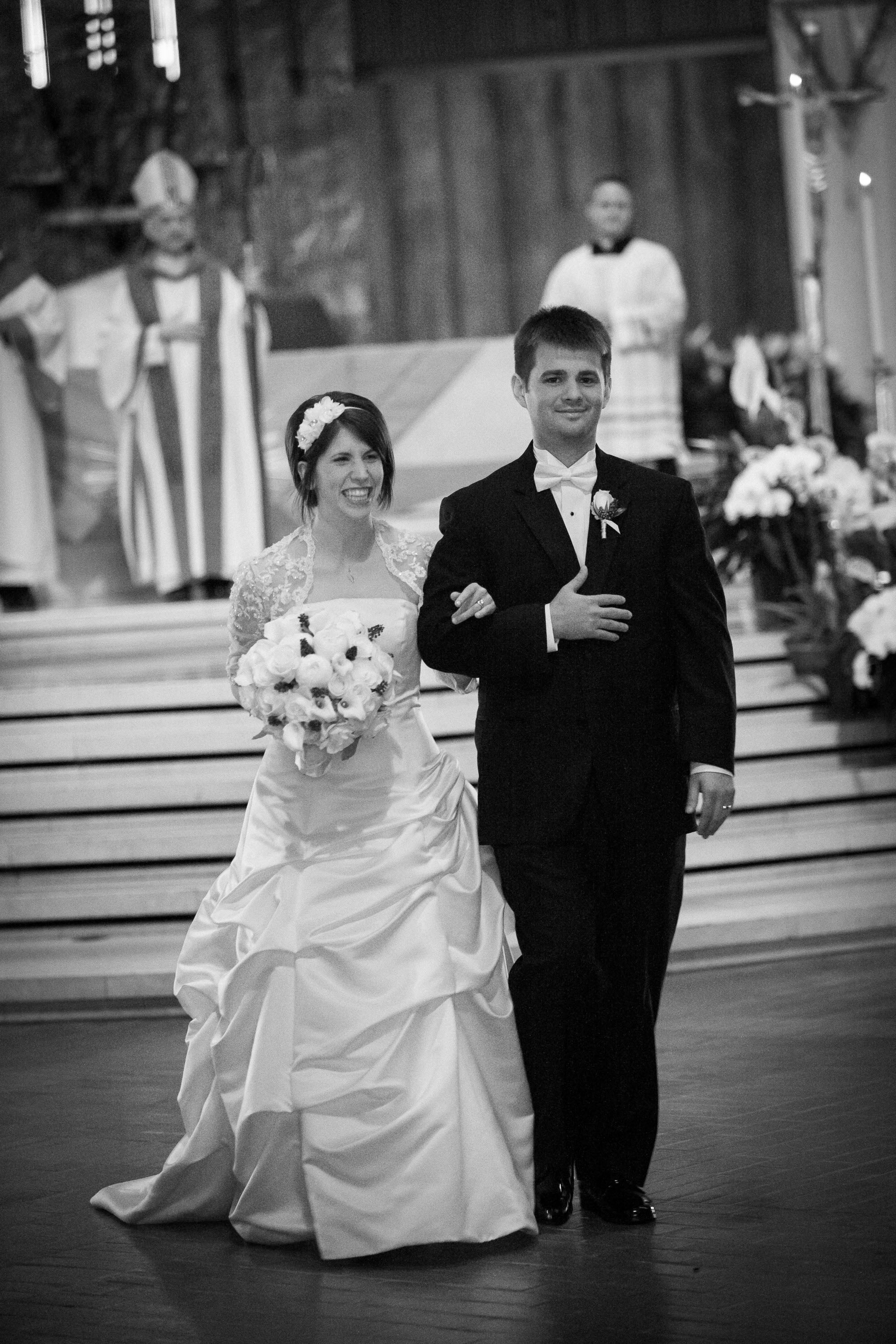 A couple leaves the altar as husband and wife,  at St. Mary's Cathedral in San Francisco.