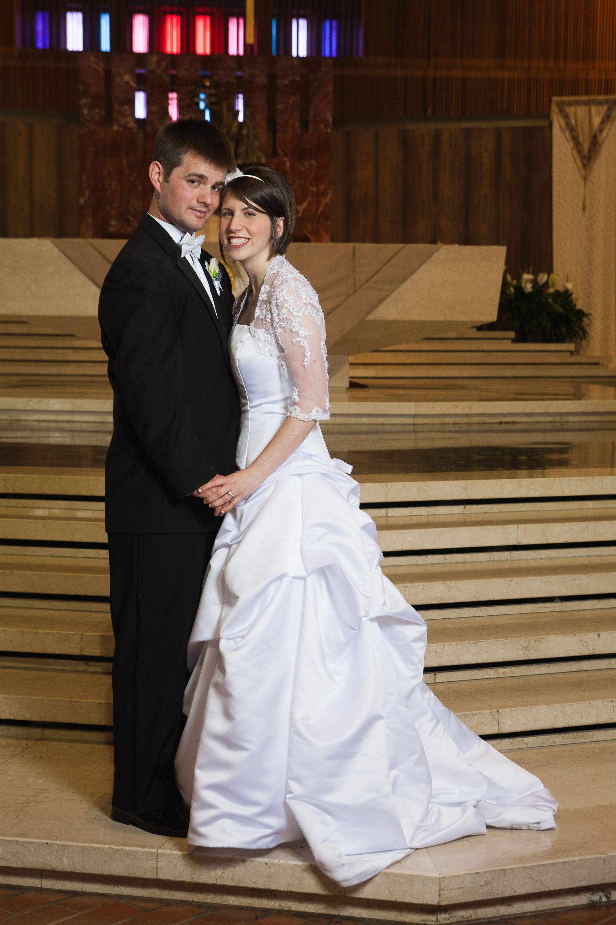 A beautiful relaxed portrait of the bride and groom  at St. Mary's Cathedral in San Francisco.