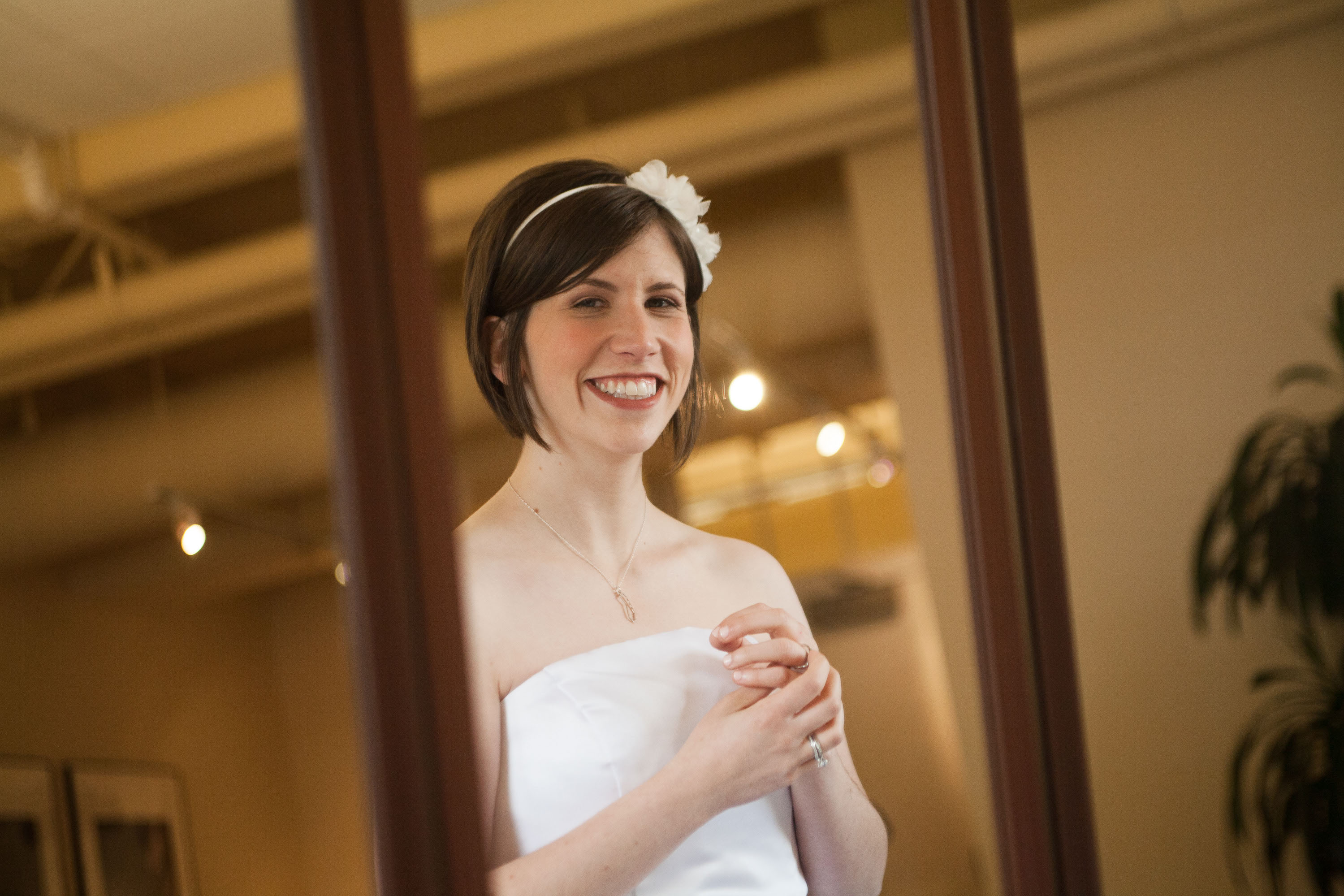The bride grins in a candid picture at The San Francisco Film Centre
